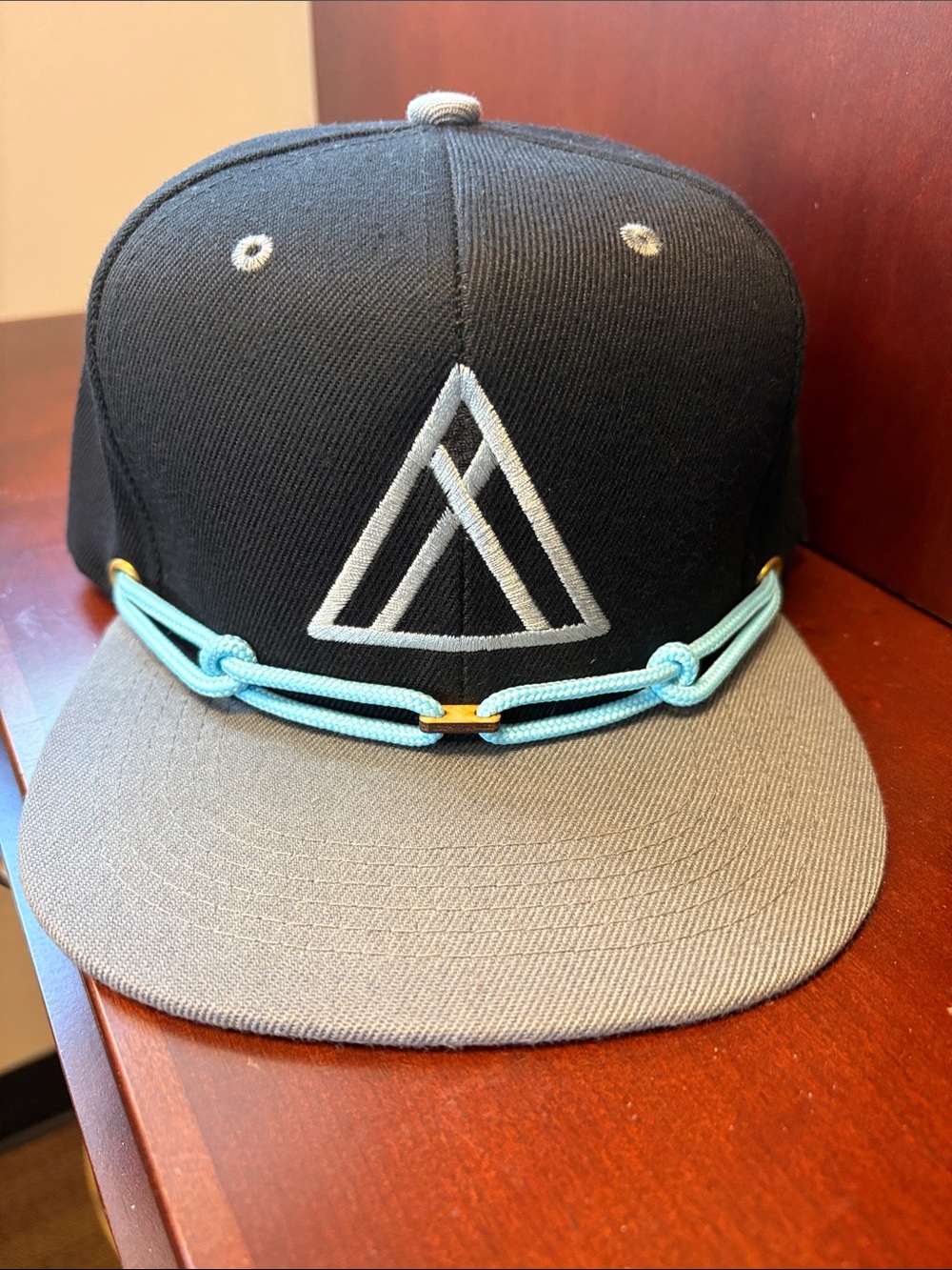 Black and Gray Snapback Hat with Light Blue Rope Accent